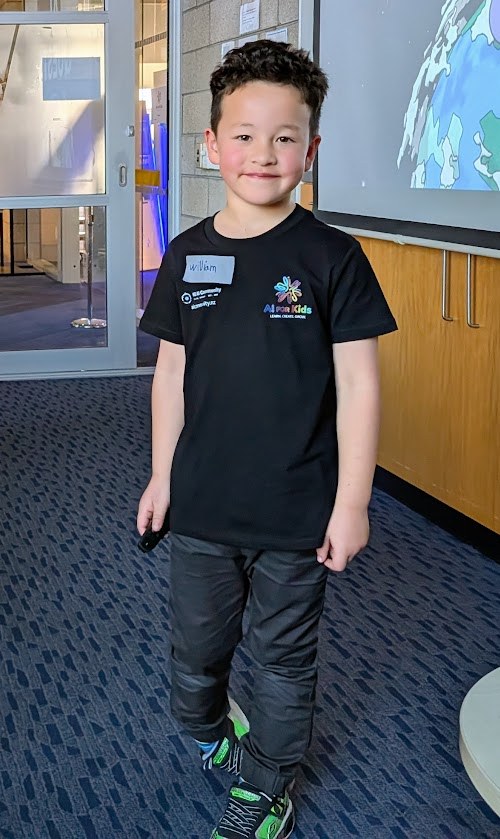 William in his AI for Kids t-shirt at an AI Quests workshop